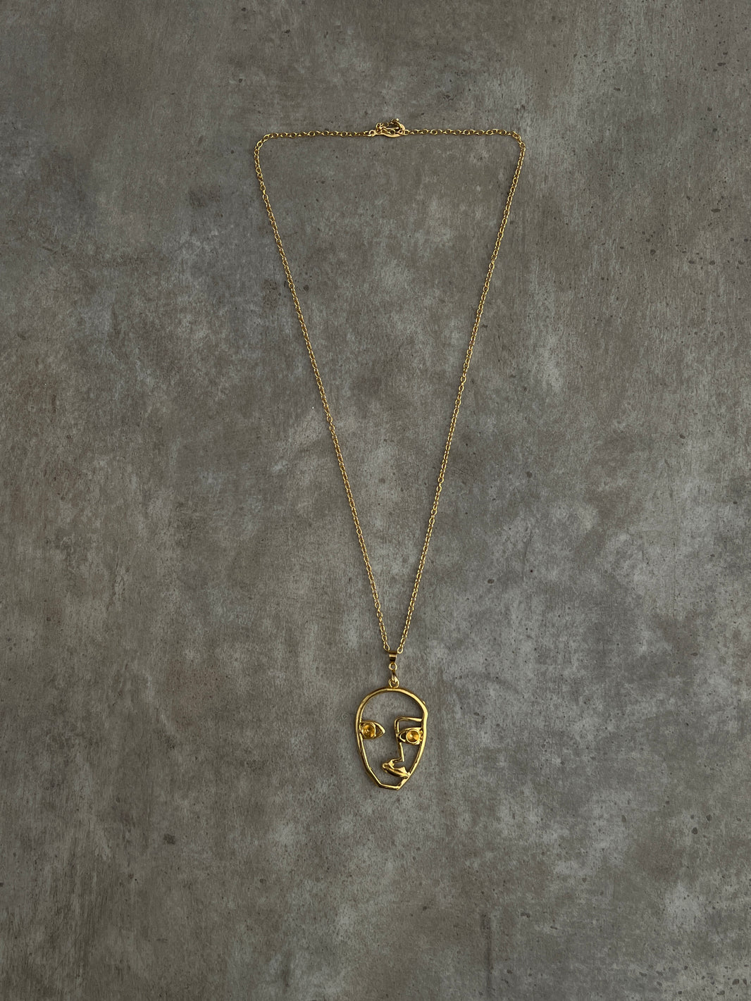 GOLD FACE NECKLACE
